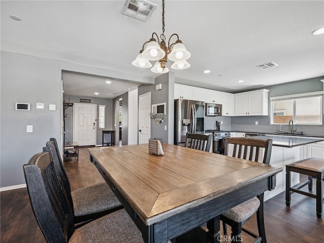 11760 Espola Pl, Victorville, CA 92392 - dining room featuring dark wood-type flooring, a chandelier, and recessed lighting