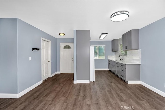 2246 Beachwood Dr, Merced, CA 95348 - kitchen featuring gray cabinetry, light countertops, dark wood-type flooring, and tasteful backsplash