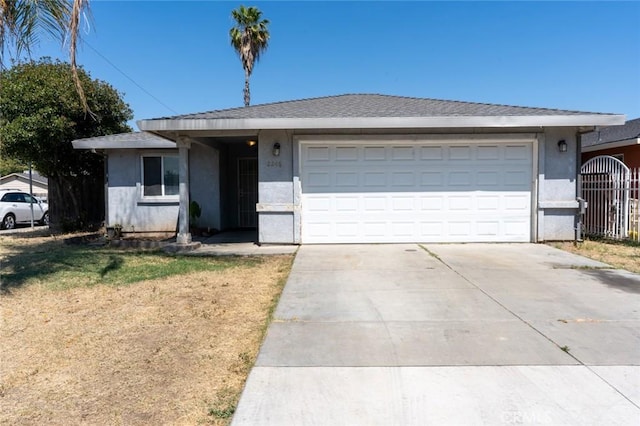 2246 Beachwood Dr, Merced, CA 95348 - ranch-style home with concrete driveway, stucco siding, and a garage