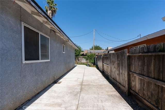 2246 Beachwood Dr, Merced, CA 95348 - view of property exterior with stucco siding and a patio area