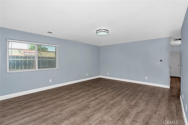 2246 Beachwood Dr, Merced, CA 95348 - spare room with dark wood-type flooring and baseboards