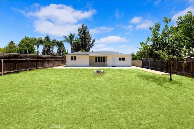 1851 S San Antonio Ave, Pomona, CA 91766 - rear view of property featuring a patio, an outdoor fire pit, and a fenced backyard