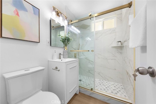 1851 S San Antonio Ave, Pomona, CA 91766 - bathroom featuring a marble finish shower, vanity, and wood finished floors