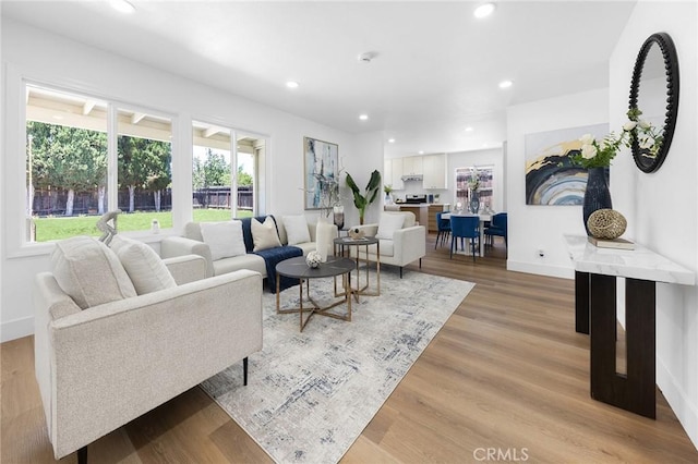 1851 S San Antonio Ave, Pomona, CA 91766 - living room featuring healthy amount of natural light, recessed lighting, and light wood finished floors