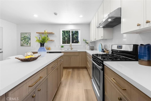 1851 S San Antonio Ave, Pomona, CA 91766 - kitchen with extractor fan, gas stove, light wood-type flooring, light countertops, and open shelves