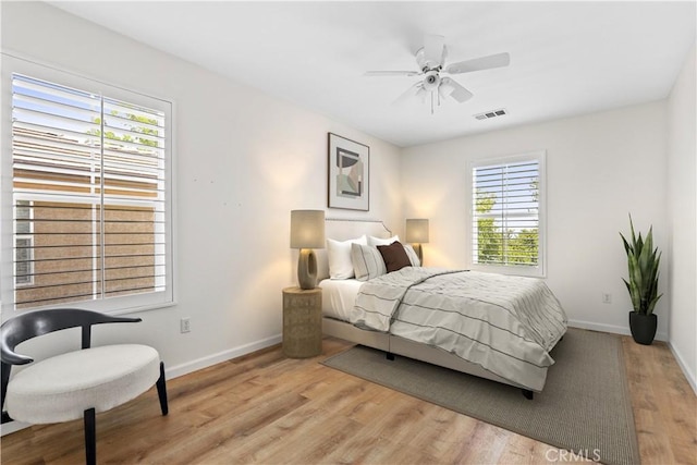 27664 Cordovan Dr, Canyon Country, CA 91351 - bedroom with multiple windows, light wood-type flooring, and a ceiling fan