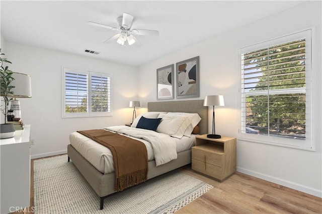 27664 Cordovan Dr, Canyon Country, CA 91351 - bedroom featuring multiple windows, light wood-type flooring, and ceiling fan