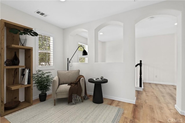 27664 Cordovan Dr, Canyon Country, CA 91351 - living area with wood finished floors, an upstairs landing, and arched walkways