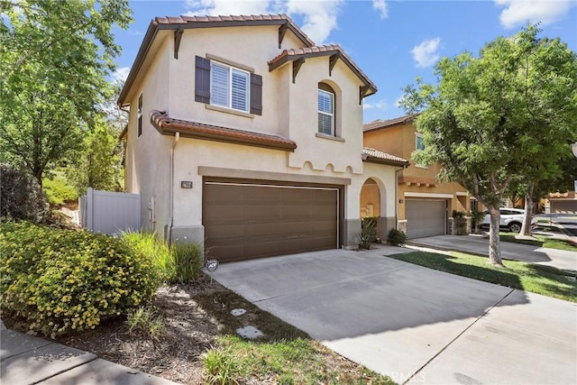 27664 Cordovan Dr, Canyon Country, CA 91351 - mediterranean / spanish-style house featuring a tile roof, driveway, stucco siding, and a garage