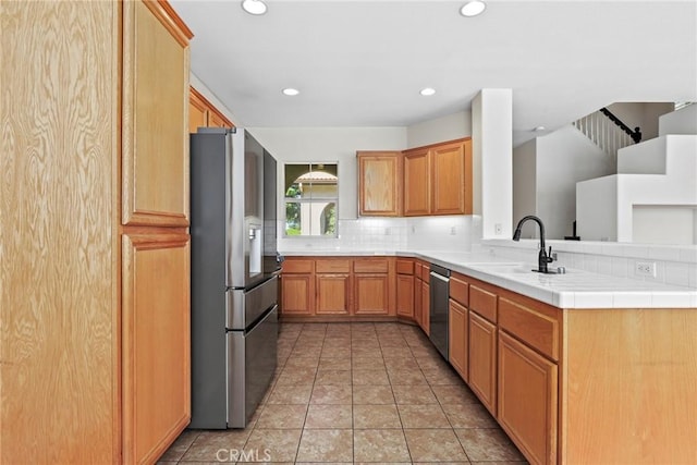 27664 Cordovan Dr, Canyon Country, CA 91351 - kitchen featuring stainless steel appliances, decorative backsplash, recessed lighting, and a peninsula
