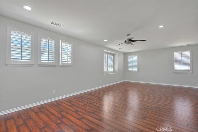12790 Golden Leaf Dr, Rancho Cucamonga, CA 91739 - spare room featuring plenty of natural light, a ceiling fan, dark wood-style flooring, and recessed lighting