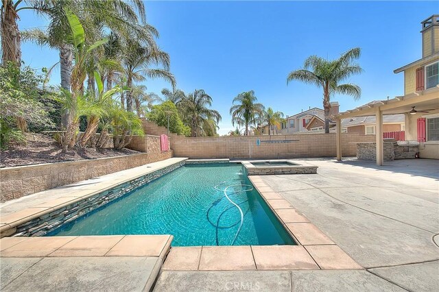 12790 Golden Leaf Dr, Rancho Cucamonga, CA 91739 - view of swimming pool with a patio, a fenced backyard, a ceiling fan, and a pool with connected hot tub