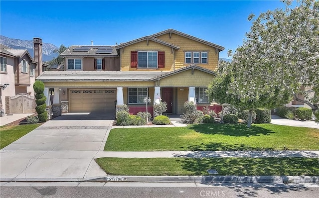 12790 Golden Leaf Dr, Rancho Cucamonga, CA 91739 - craftsman inspired home with roof mounted solar panels, a garage, concrete driveway, a front yard, and stone siding
