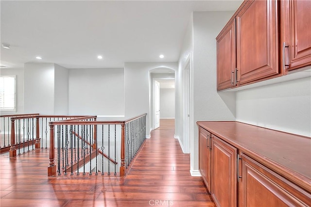 12790 Golden Leaf Dr, Rancho Cucamonga, CA 91739 - corridor with an upstairs landing, wood finished floors, arched walkways, and recessed lighting