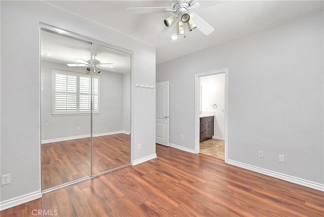 12790 Golden Leaf Dr, Rancho Cucamonga, CA 91739 - unfurnished bedroom with a closet, wood finished floors, ceiling fan, and connected bathroom