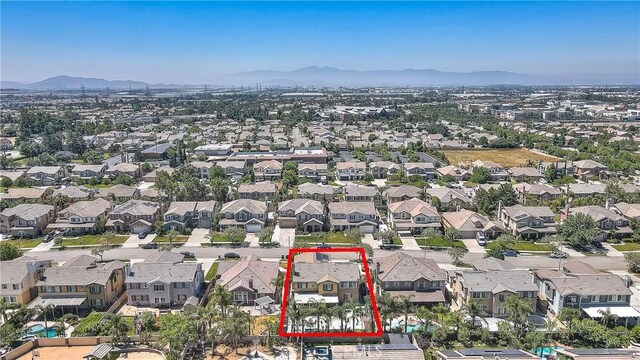 12790 Golden Leaf Dr, Rancho Cucamonga, CA 91739 - aerial perspective of suburban area featuring property parcel outlined and a mountainous background