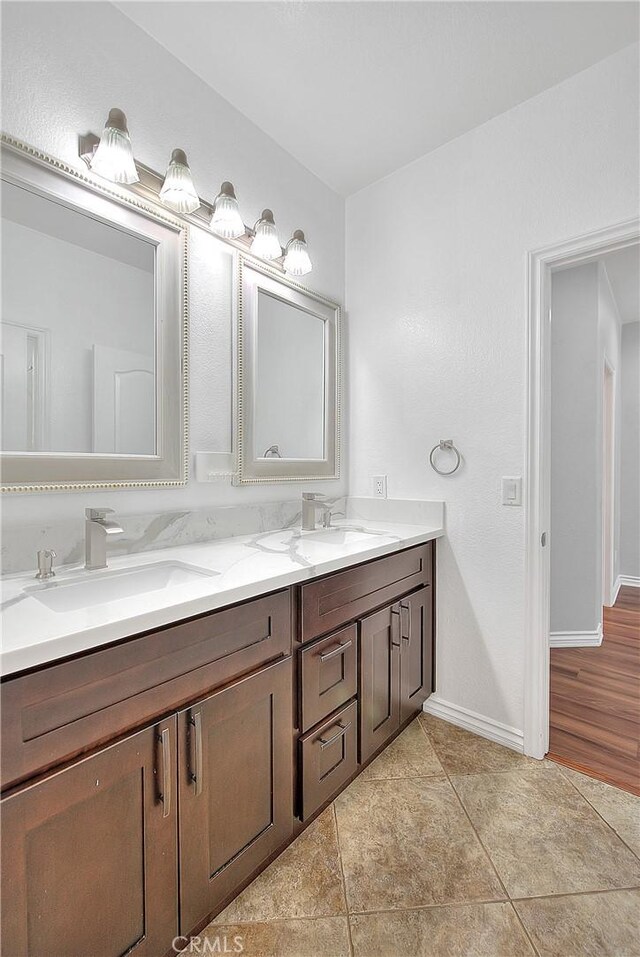 12790 Golden Leaf Dr, Rancho Cucamonga, CA 91739 - full bathroom featuring double vanity and tile patterned flooring