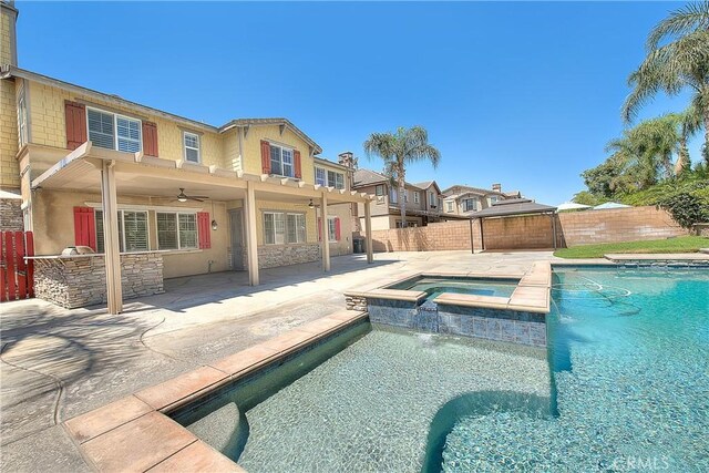 12790 Golden Leaf Dr, Rancho Cucamonga, CA 91739 - view of pool featuring ceiling fan, a fenced backyard, a patio area, a pool with connected hot tub, and area for grilling