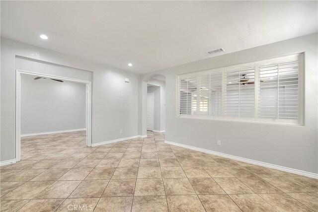 12790 Golden Leaf Dr, Rancho Cucamonga, CA 91739 - unfurnished room with arched walkways, recessed lighting, a ceiling fan, and light tile patterned flooring