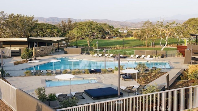204 Lily Loop, Irvine, CA 92618 - community pool featuring a mountain view and a patio