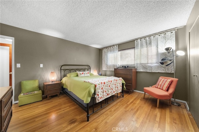 5110 E Atherton St Unit 57, Long Beach, CA 90815 - bedroom with a textured ceiling and light wood finished floors