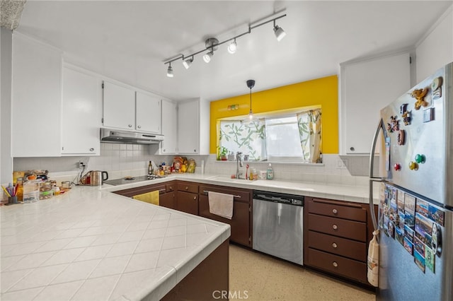 5110 E Atherton St Unit 57, Long Beach, CA 90815 - kitchen featuring stainless steel appliances, under cabinet range hood, tasteful backsplash, white cabinetry, and tile countertops