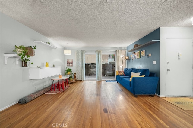5110 E Atherton St Unit 57, Long Beach, CA 90815 - living room with wood finished floors and a textured ceiling