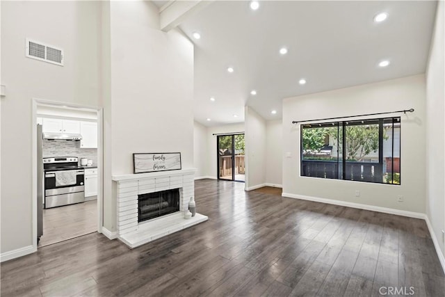 4366 Fairview Ave Unit 6, Arcadia, CA 91007 - unfurnished living room featuring dark wood-style flooring, a fireplace, recessed lighting, and high vaulted ceiling