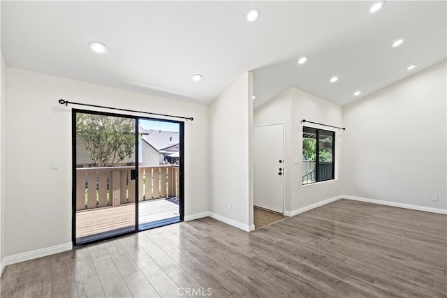 4366 Fairview Ave Unit 6, Arcadia, CA 91007 - unfurnished room with wood finished floors, vaulted ceiling, and recessed lighting