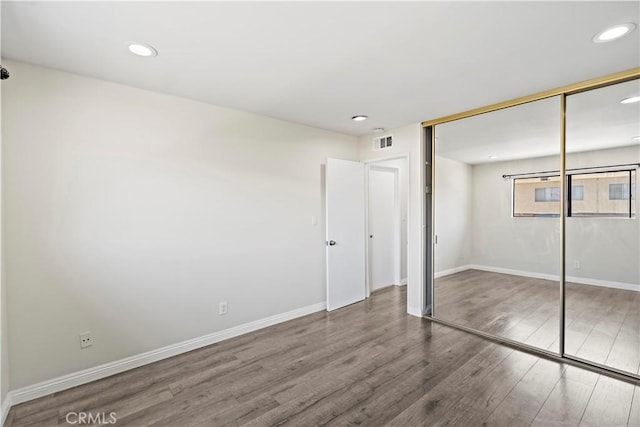 4366 Fairview Ave Unit 6, Arcadia, CA 91007 - unfurnished bedroom featuring wood finished floors, a closet, and recessed lighting