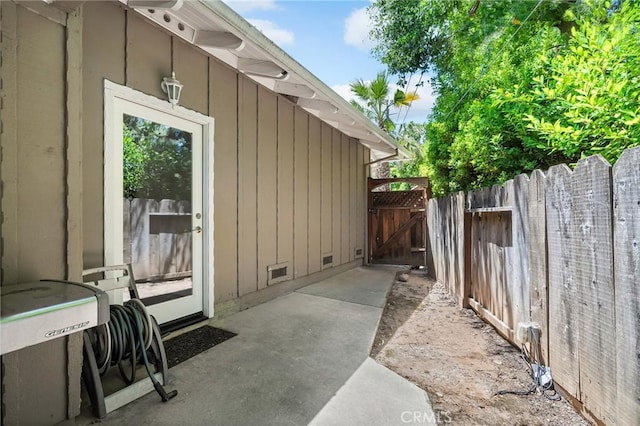 45 Covell Park Ave, Chico, CA 95926 - view of side of home featuring a gate, board and batten siding, and crawl space