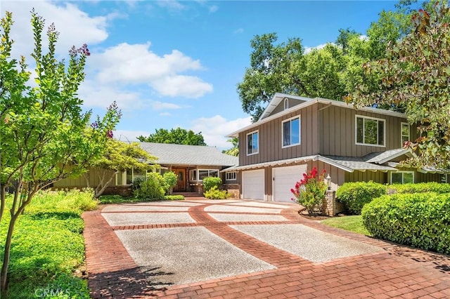 45 Covell Park Ave, Chico, CA 95926 - view of front of home with board and batten siding, decorative driveway, and a garage