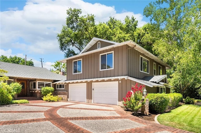 45 Covell Park Ave, Chico, CA 95926 - view of front of property featuring board and batten siding, decorative driveway, and a garage