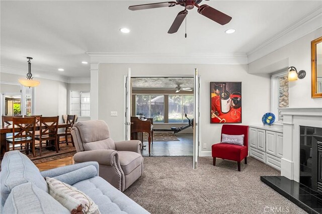 45 Covell Park Ave, Chico, CA 95926 - living area featuring ceiling fan, a fireplace with raised hearth, recessed lighting, ornamental molding, and carpet