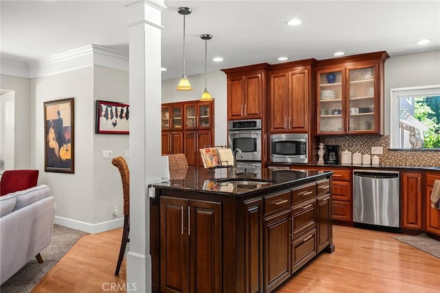 45 Covell Park Ave, Chico, CA 95926 - kitchen featuring appliances with stainless steel finishes, recessed lighting, glass insert cabinets, backsplash, and hanging light fixtures