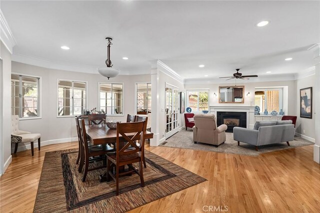 45 Covell Park Ave, Chico, CA 95926 - dining area with ornamental molding, light wood-type flooring, recessed lighting, a ceiling fan, and a glass covered fireplace