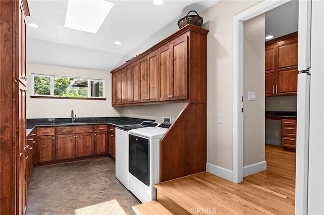 45 Covell Park Ave, Chico, CA 95926 - kitchen featuring a skylight, dark countertops, freestanding refrigerator, recessed lighting, and vaulted ceiling