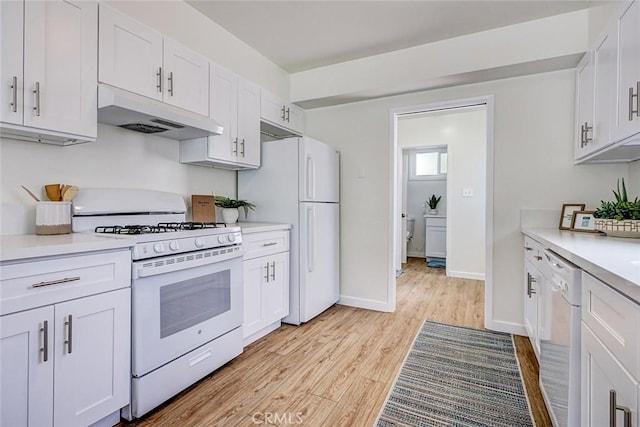 426 S Broadway, Redondo Beach, CA 90277 - kitchen featuring white appliances, under cabinet range hood, light wood-style flooring, and white cabinets