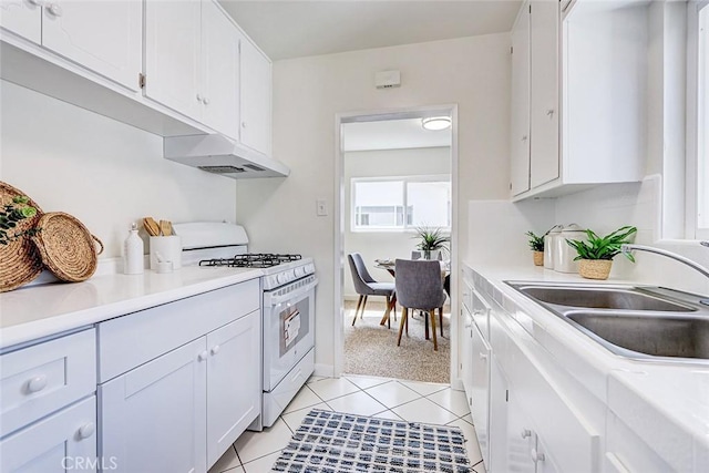 426 S Broadway, Redondo Beach, CA 90277 - kitchen featuring white gas range oven, white cabinetry, light countertops, and under cabinet range hood