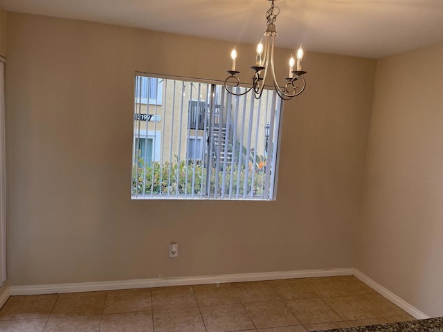 17189 W Bernardo Dr W Unit 103, San Diego, CA 92127 - tiled empty room with healthy amount of natural light and a chandelier