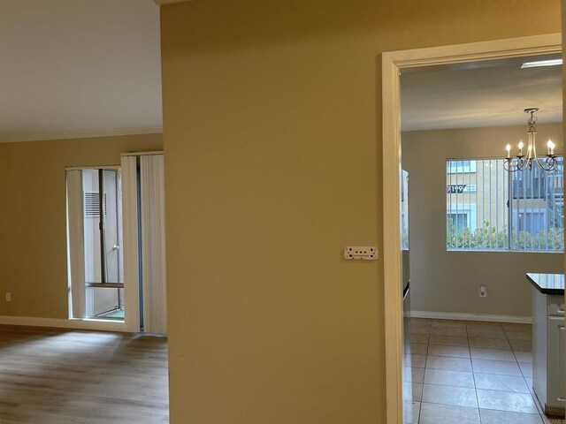 17189 W Bernardo Dr W Unit 103, San Diego, CA 92127 - corridor featuring a chandelier and ornamental molding