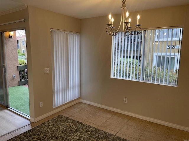 17189 W Bernardo Dr W Unit 103, San Diego, CA 92127 - unfurnished dining area featuring a chandelier and tile patterned floors