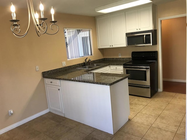 17189 W Bernardo Dr W Unit 103, San Diego, CA 92127 - kitchen with stainless steel appliances, a peninsula, a chandelier, white cabinetry, and light tile patterned floors