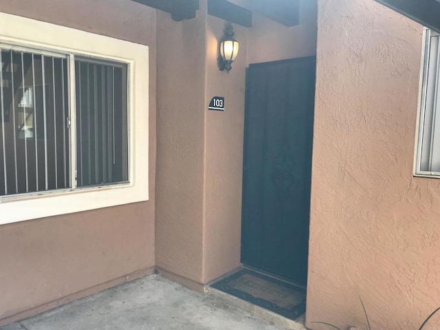 17189 W Bernardo Dr W Unit 103, San Diego, CA 92127 - property entrance with stucco siding