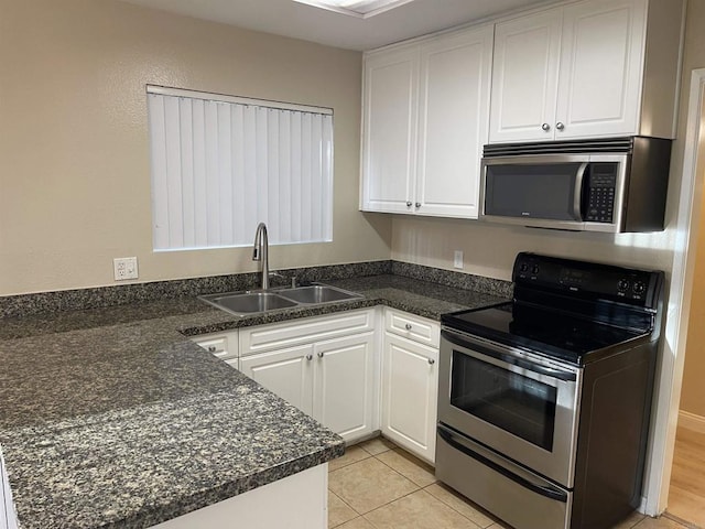 17189 W Bernardo Dr W Unit 103, San Diego, CA 92127 - kitchen featuring stainless steel appliances, white cabinetry, a peninsula, and light tile patterned floors