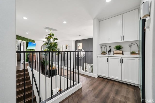12400 Sarah Ct, El Monte, CA 91732 - corridor featuring dark wood-style floors, a chandelier, recessed lighting, and an upstairs landing