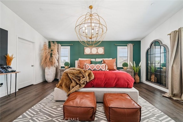 12400 Sarah Ct, El Monte, CA 91732 - bedroom with multiple windows, a chandelier, wood finished floors, and access to exterior