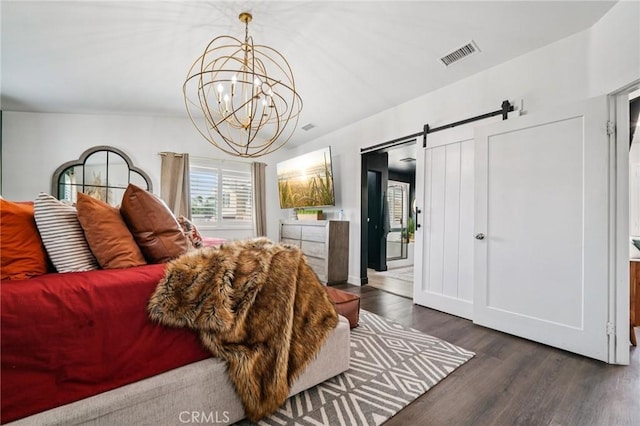 12400 Sarah Ct, El Monte, CA 91732 - bedroom with wood finished floors, a barn door, and a chandelier