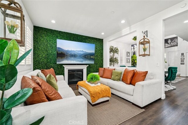 12400 Sarah Ct, El Monte, CA 91732 - living area with wood finished floors, recessed lighting, and an accent wall