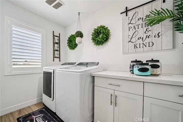 12400 Sarah Ct, El Monte, CA 91732 - laundry area with washer and dryer, cabinet space, and light wood-style flooring